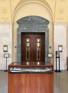 Court room #1, entrance with blue hearing loop signs on each side of the door