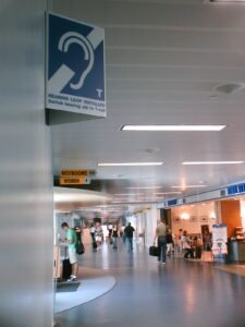 Gerald R. Ford International Airport Concourse with hearing loop sign on wall