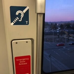 Inside of BART car with hearing loop logo