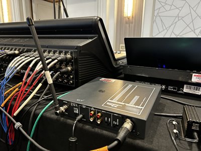 AV booth showing equipment and FM transmitter attached