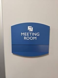 Meeting room sign with hearing loop symbol and the words "meeting room"