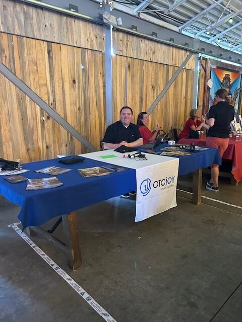 exhibit booth with temporary hearing loop on floor